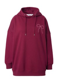 Felpa borgogna con vestibilità ampia, dotata di cappuccio con cordoncino e ricamo di un fiocco rosa sul davanti. Realizzata in un morbido tessuto testurizzato.