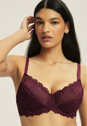 Burgundy lace bra with underwire and matching satin straps, featuring floral pattern and scalloped edges for added detail.