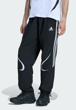 TEAMGEIST - Tracksuit bottoms - black   black   white