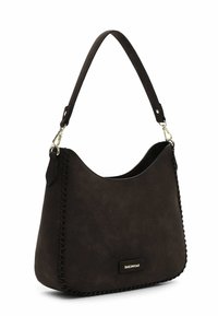 Brown faux suede handbag with a curved shape, top handle, and decorative stitching along the edge. Features a gold-tone logo detail.