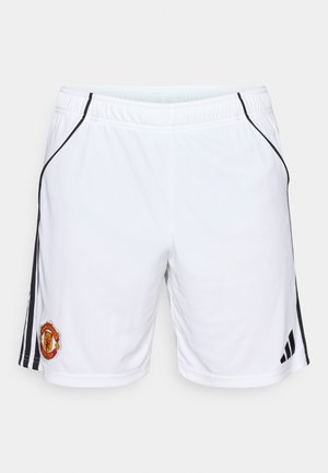 Fehér sportnadrág könnyű anyagból, fekete oldalsávokkal és Manchester United logóval a bal lábon. Rugalmas derékpánt.