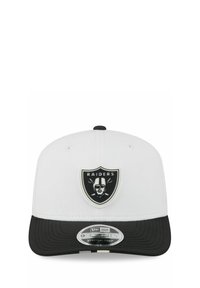 White cap with a black visor. Features a black and white Raiders logo on the front. Stretch-snap design, smooth material, and minor stitching details.