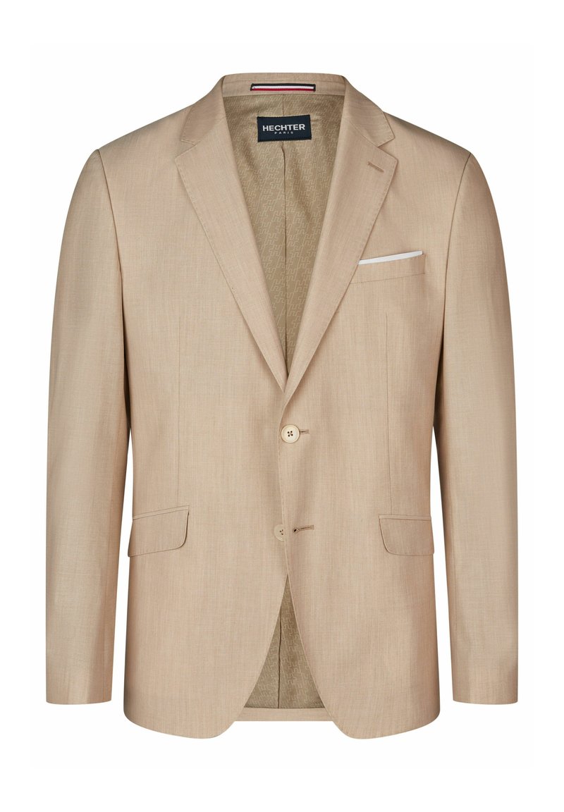 Blazer beige avec une texture lisse, deux poches avant, deux boutons et un mouchoir de poche. L'intérieur présente une doublure à motifs.
