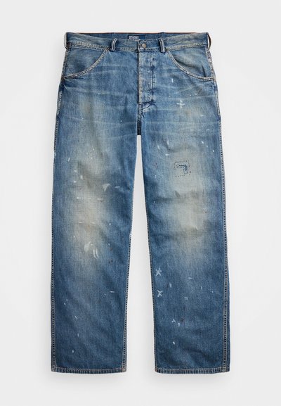 Light blue denim jeans with a faded finish, featuring paint-like speckles, a patched area, and a straight-leg cut. Classic five-pocket design.