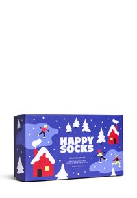 Dárková krabička pro Happy Socks s vánočním motivem obsahující sněhuláky, stromy a červené domky, vše umístěné na modrém pozadí.
