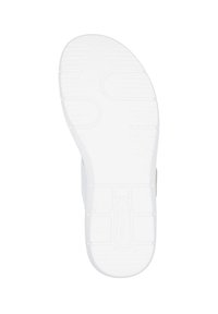 White rubber sole with a textured pattern, featuring rounded edges and raised segments for grip. Light-colored upper with minimal accents.