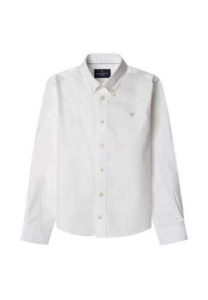Hvid langærmet skjorte med knapper, knaplukket krave og lille broderet logo med krydsede årer på venstre bryst.