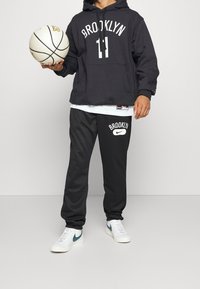 Nike Performance Felpa con cappuccio - black