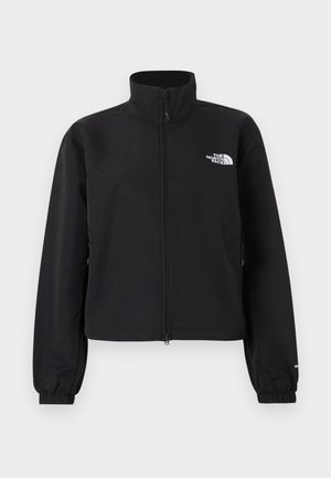 Veste noire à zip intégral avec col montant, poignets élastiques et logo blanc "The North Face" sur la poitrine gauche.