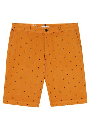 Orange shorts made of cotton, featuring a repeating small dark pattern. They have pockets and a button closure. Smooth texture.