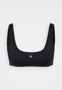 Black crop top bra made of smooth material with wide straps and a square neckline. Features a small, white CK logo on the front.