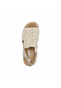 Beige sandal with a woven upper, open design, and cushioned footbed. It features a textured surface and a wide strap for comfort.