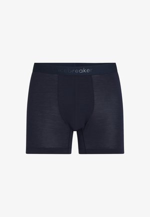 Herre boxershorts i marineblå med en bred linning, hvor mærkenavnet "icebreaker" er diskret trykt i kontrastfarve.