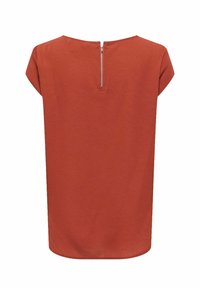 Blouse orange rouille à manches courtes avec tissu texturé et fermeture éclair centrale au dos au niveau de l'encolure.