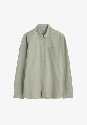 Camicia verde chiaro a maniche lunghe realizzata in tessuto morbido, dotata di colletto a punta, taschino anteriore e chiusura con bottoni sul davanti.