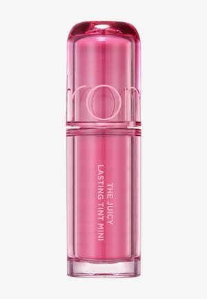 Rosa zylindrischer Lippenstiftbehälter mit abgerundetem Deckel, beschriftet mit "THE JUICY LASTING TINT MINI" in weißer Schrift.