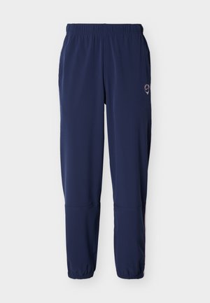 Marineblaue Sporthose mit elastischem Bund und Bündchen, geradem Schnitt und kleinem Logo an der oberen linken Oberschenkelseite.