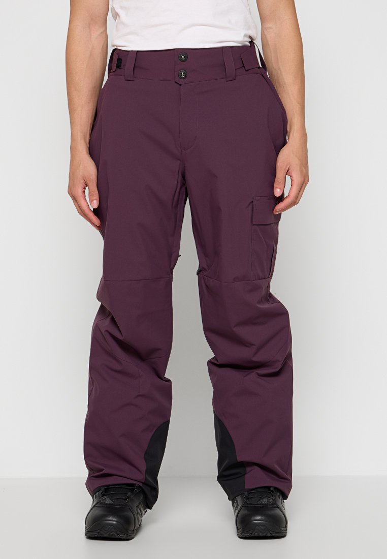 Pantaloni da neve viola con una vestibilità comoda, dotati di due chiusure a bottone, una tasca cargo laterale e dettagli neri ai polsini. Materiale impermeabile.