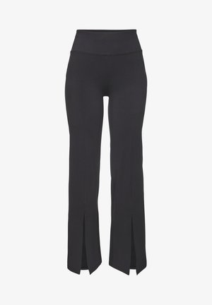 Black leggings with a high waist, featuring side slits at the cuffs, made from stretchy, smooth fabric for ease of movement.