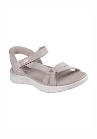 Sandal gris claro con correas de tela texturizada, cierres de Velcro ajustables y una suela externa blanca acolchada para comodidad y soporte.