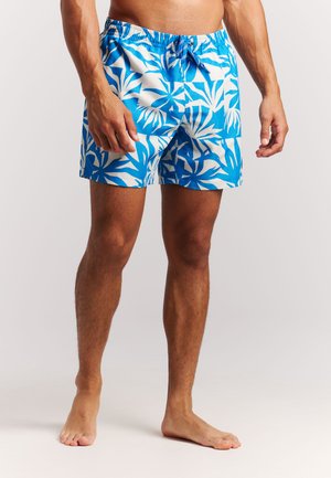 Blauwe zwembroek met een wit bladpatroon, elastische tailleband met trekkoord, lichtgewicht stof en een korte lengte.