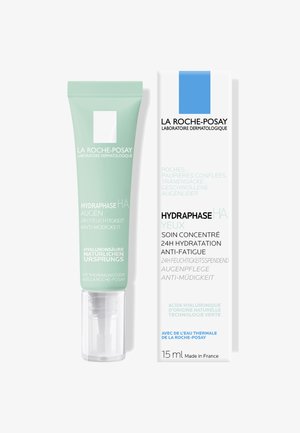 Hydraphase HA eye cream in a light green tube with a transparent cap. Box displays product details and branding in multiple languages, size 15 ml.