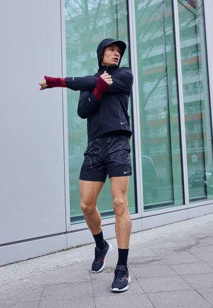 STRIDE - Pantaloncini sportivi - black