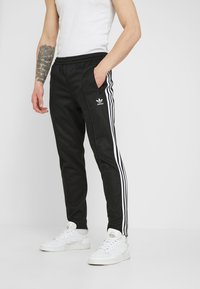 adidas Originals - BECKENBAUER - Pantalon de survêtement - black Image miniature 1