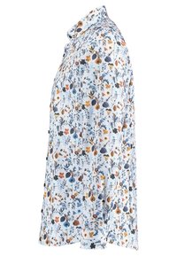 Long-sleeve shirt featuring a white background with a colorful floral pattern in blue, orange, and black. Soft, textured fabric. Collared design.