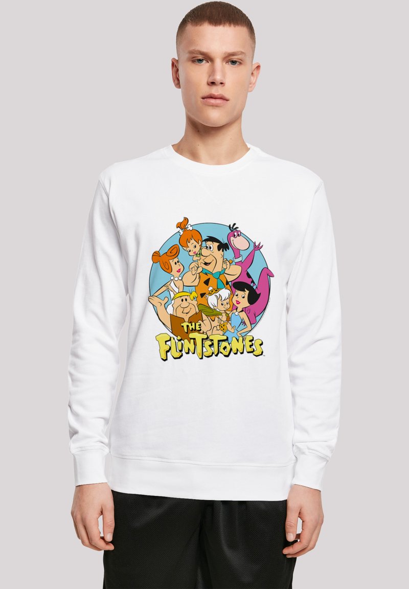 Valge kapuutsiga sweatshirt, millel on värvikas graafika Flintstones'i tegelastest ja tekst alumisel serval. Kangas näeb välja pehme ja juhuslik.