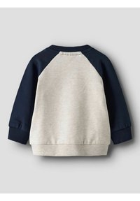 Sweatshirt met een crèmekleurig lijf, donkerblauwe raglanmouwen, geribbelde manchetten en tailleband. Zachte stof met een gladde textuur.