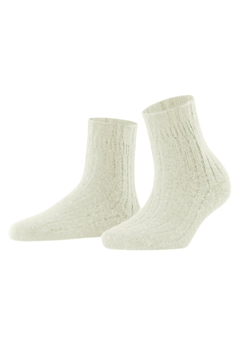 Calzini alla caviglia a coste in off-white, realizzati in un materiale morbido. Presentano una superficie testurizzata e un design aderente per il massimo comfort.