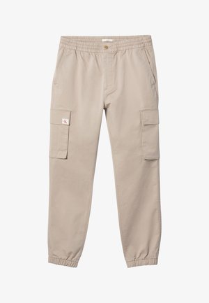 Beežid püksid elastse vöökoha ja mansettidega, nööpidega kinnituv, küljetaskud ja klappidega taskud mõlemal reiel. Vasaku taskuklapi peal väike logo.