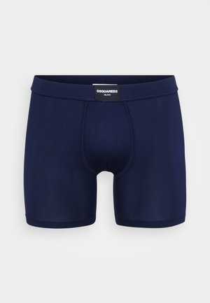 Boxer briefs masculinos azul-marinho feitos de um tecido elástico, com um bolso contornado e uma cintura elástica com marca.