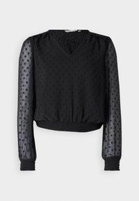 Top noir court avec un décolleté en V, en tissu texturé, motif à pois, manches longues transparentes, avec des poignets et un ourlet élastiques.