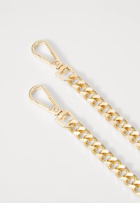 Gold metal chain with a glossy finish, featuring two clasps. Links are oval-shaped and interlocked, displaying a smooth texture.