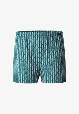 Zwemshorts met een elastische tailleband, met een geometrisch patroon in teal en wit, gemaakt van lichtgewicht stof.
