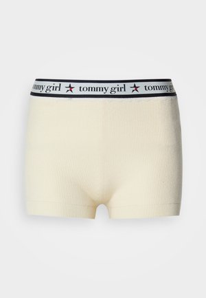 Tej pamut keverék fiú rövidnadrág krém színben, bordázott textúrával és széles derékkal, rajta a "tommy girl" logóval és piros csillag díszítésekkel.