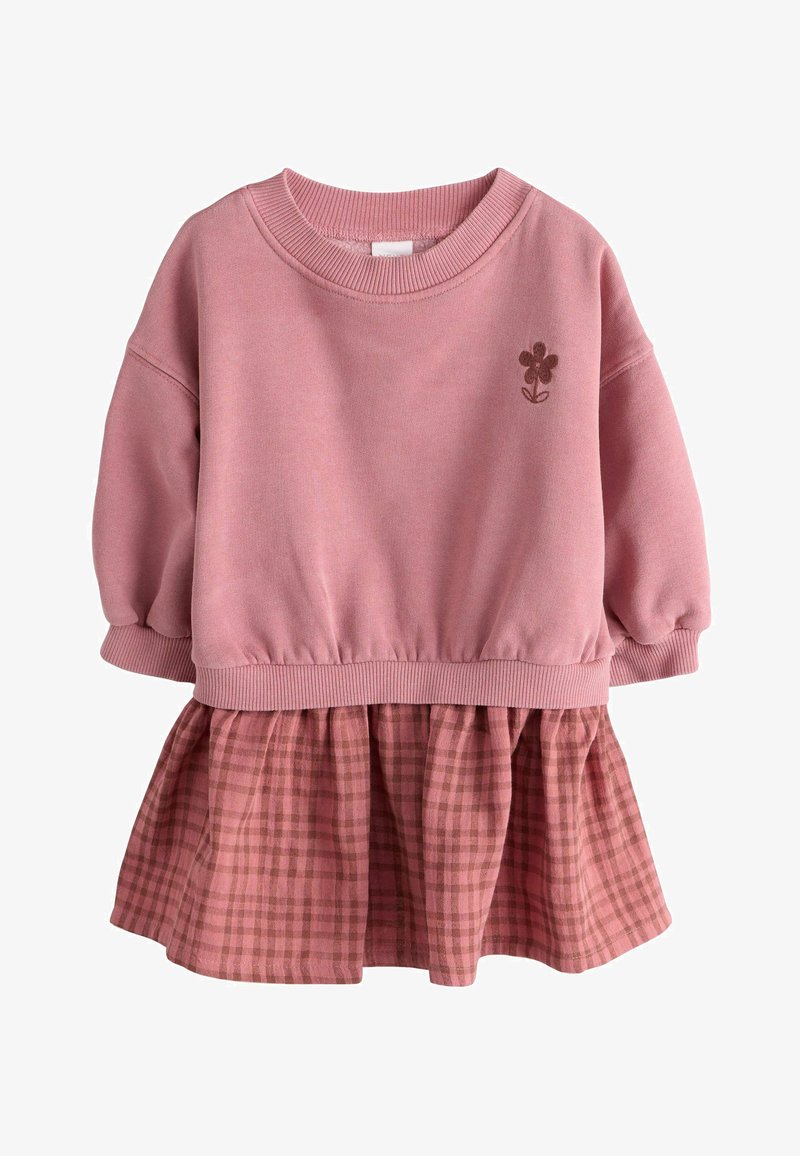 Rozā mazuļa kleita ar gariem uzpūstiem piedurknēm, ribotām aprocēm un apkakli, nelielu izšūtu ziedu un pievienotu rūtainu svārku.