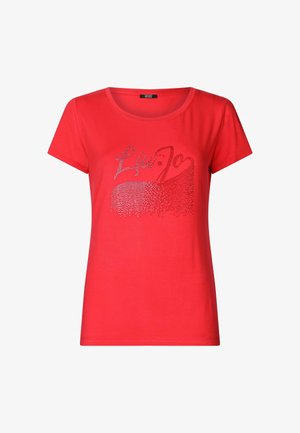 T-shirt rossa in morbido tessuto con maniche corte, caratterizzata da una grafica argentata scintillante con il testo "Liu Jo" sulla parte anteriore.