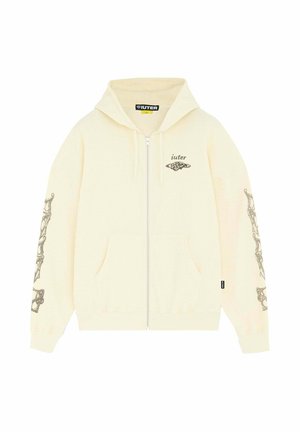 Felpa con cappuccio color crema con cerniera, tasche frontali, logo "iuter" e grafica sul petto, e design scheletrico nero lungo entrambe le maniche.