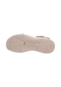 Suela de zapato beige claro con patrones de agarre texturizados, que presenta un logo marcado "TECNOLOGÍA SUIZA" y un diseño suave y ligeramente curvado.