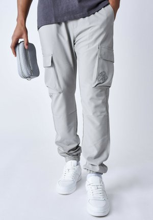 EN MATIÈRE TECHNIQUE - Pantalones cargo - gris clair