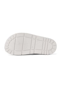 Suola di scarpa in gomma bianca con superficie texturizzata, caratterizzata da un modello di battistrada segmentato per aderenza e stabilità, punta tonda e tacco rialzato.