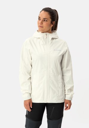 Lightweight, cream-colored women's jacket with a hood, front zip, elastic cuffs, and subtle logo detail. Suitable for outdoor activities.
