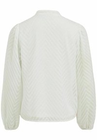 Valkoinen paita, jossa on teksturoitu herringbone-kuvio, pitkät puffi-hihat ja korkea kaulus. Sileä kangas, jossa on hienostunut kiilto.