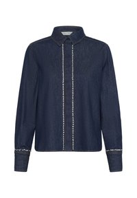 Donkerblauwe denimhemel met een kraag, voorzien van een voorpasje versierd met zilveren studs en gestudeerde manchetten. Lange mouwen met knoopmanchetten.