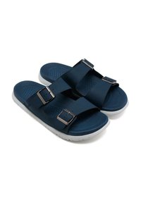 Chanclas azul marino con dos hebillas ajustables, plantilla texturizada y suela de goma blanca para agarre y comodidad. Diseño casual adecuado para climas cálidos.