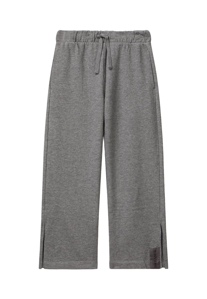 Graue weite Jogginghosen mit elastischem Bund, Kordelzug, seitlichen Taschen, kleinen Seitenschlitzen und einem "DREAM"-Etikett in der Nähe des Saums.