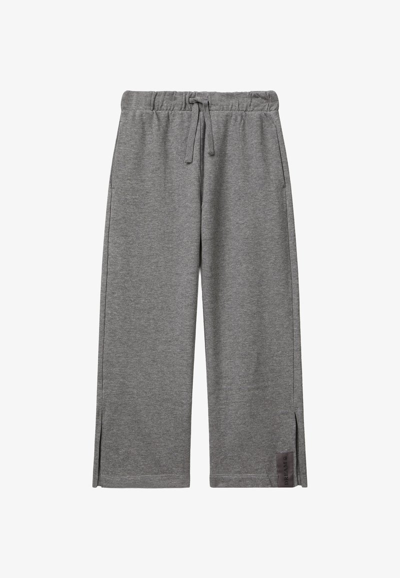 Graue weite Jogginghosen mit elastischem Bund, Kordelzug, seitlichen Taschen, kleinen Seitenschlitzen und einem "DREAM"-Etikett in der Nähe des Saums.